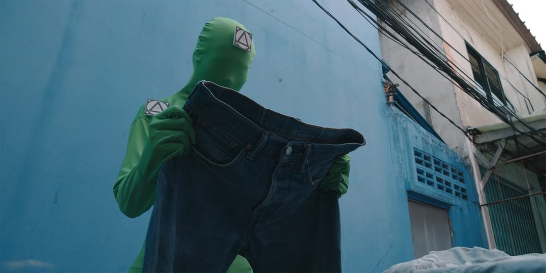 Performer in a green suit on set
